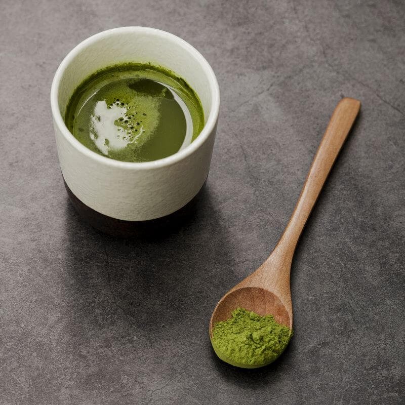 Matcha tea cup with wooden spoon